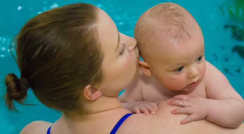 A young woman and her baby in the Njswim pool