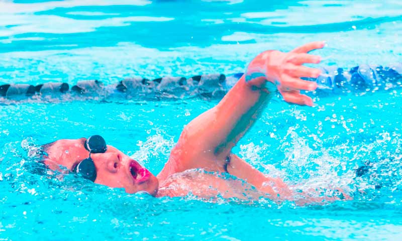 A swimming student at Njswim displaying his swimming skills