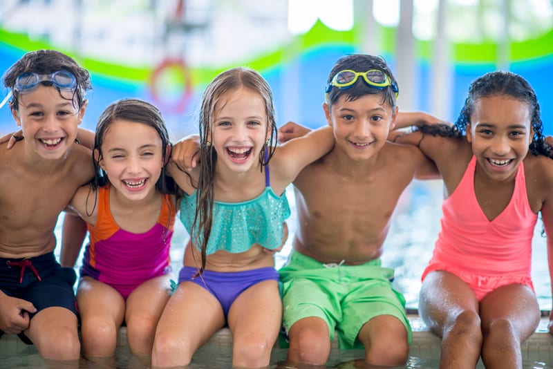 5 Children Having a Great Time Together at the Pool