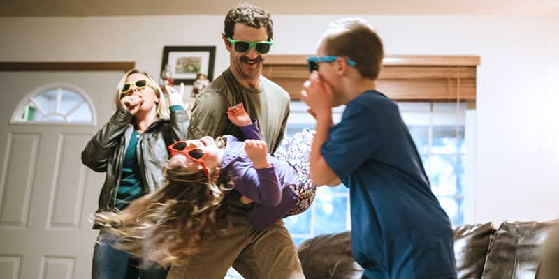 family with sunglasses singing and dancing, living-room-concert